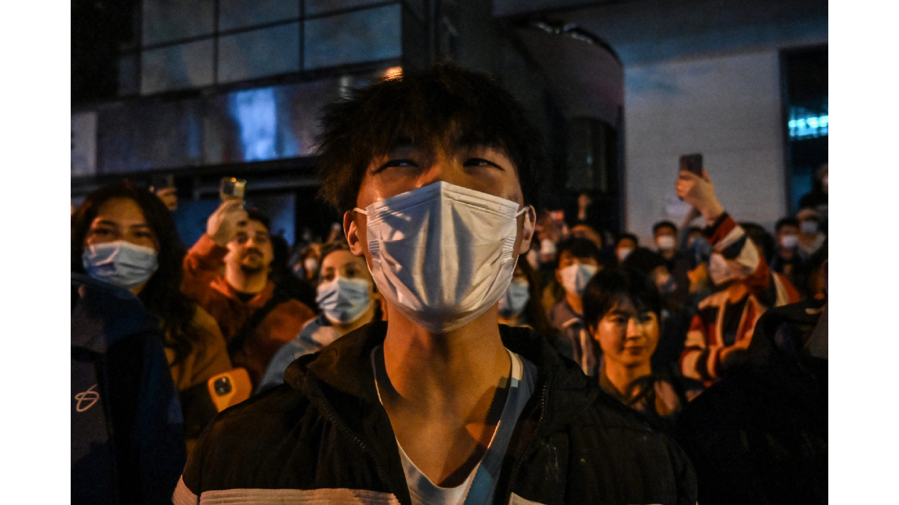 2022年11月的「白紙革命」,人民為爭取自由走上街頭(照片僅示意,非當事人)。(攝影/AFP/Hector Retamal)